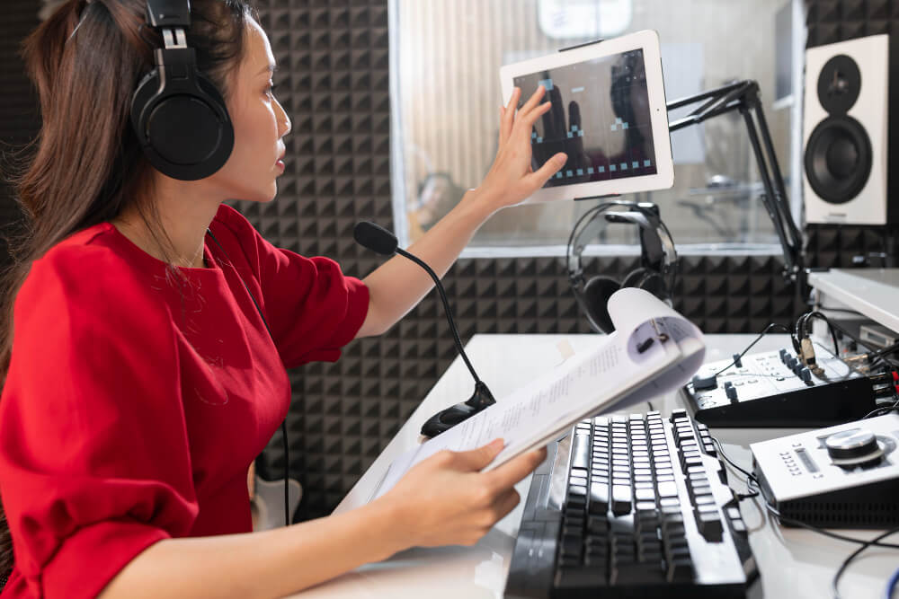 Radio Advertising Radio advertising professional recording audio in a studio with microphone, headphones, and mixing equipment